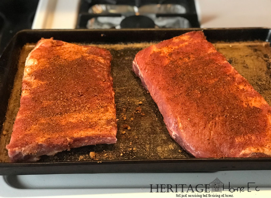 Rack of ribs resting after rib rub spice blend is applied.