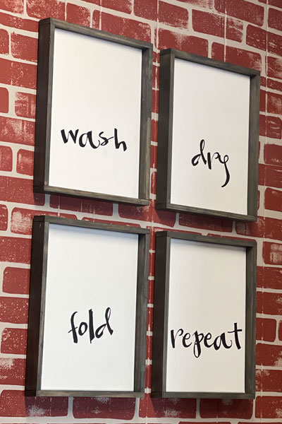 wash dry fold repeat signs on faux brick background