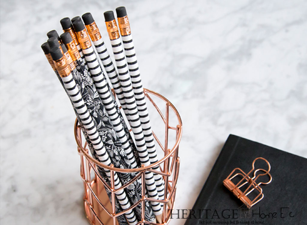 black and white pencils in copper wire cup productivity get things done do more