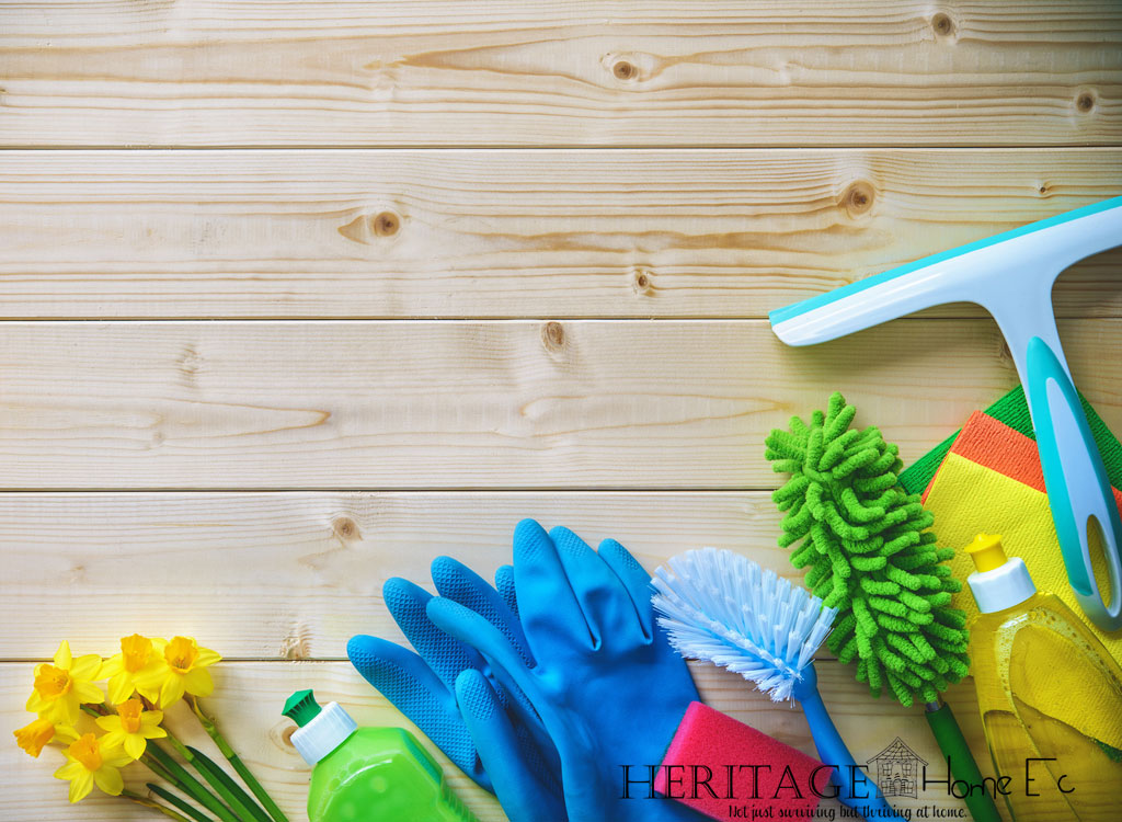 cleaning supplies on a wood background