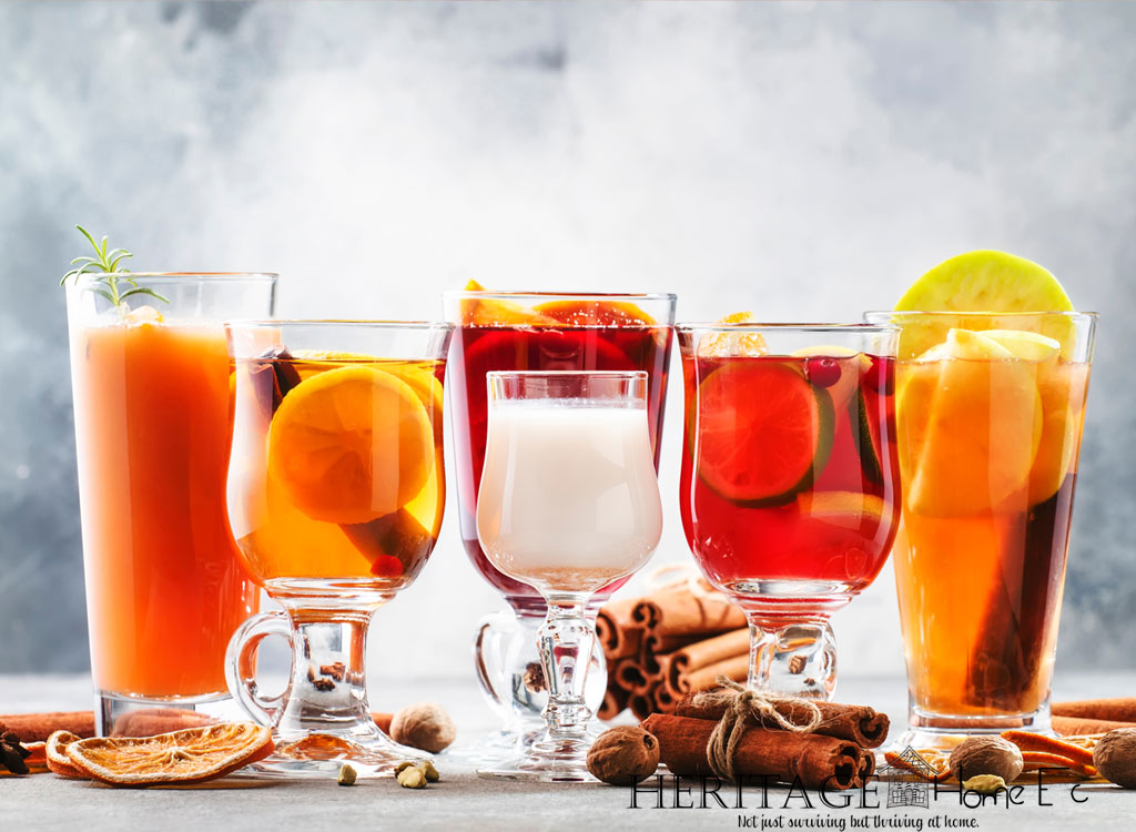 different drinks in glasses for serving with holiday decor