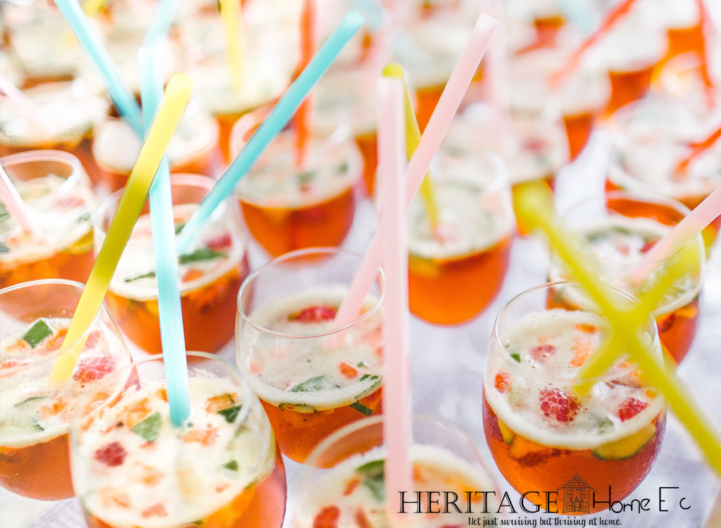 glasses of drinks on table with colorful straws