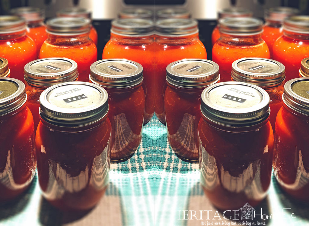 home canning jars of spiced pumpkin butter ready for storage in pantry