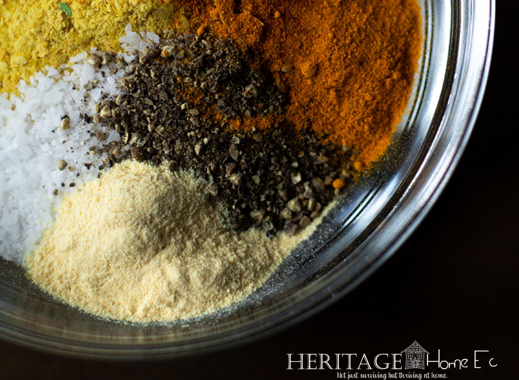 closeup of spices in a glass bowl on a black background