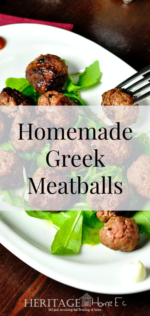 Homemade Greek Meatballs- Heritage Home Ec These Homemade Greek Meatballs are perfect used as game day food, in Homemade Gyros, or just by themselves with a side of Greek Salad. | Recipes | Food | Greek | Meatballs | Dinner | Freezer Cooking | #dinner #mealplan #recipe #recipes #food #meatballs #freezercooking #homemade #homeec #homeeconomics #homecooking #greek #greekmeatballs